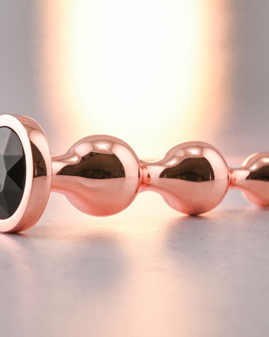 Gender X Gold Digger - Medium Rose Gold Butt Plug with Black Gem Base