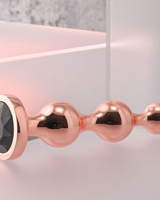 Gender X Gold Digger - Medium Rose Gold Butt Plug with Black Gem Base